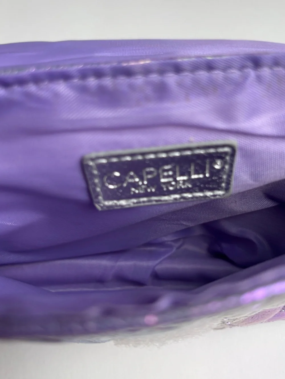 Capelli of New York Iridescent Purple Quilted Heart Crossbody